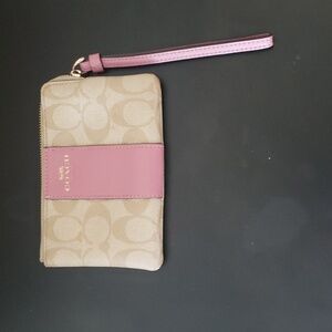 Coach wristlet; Mauve color strip; Used in great Condition